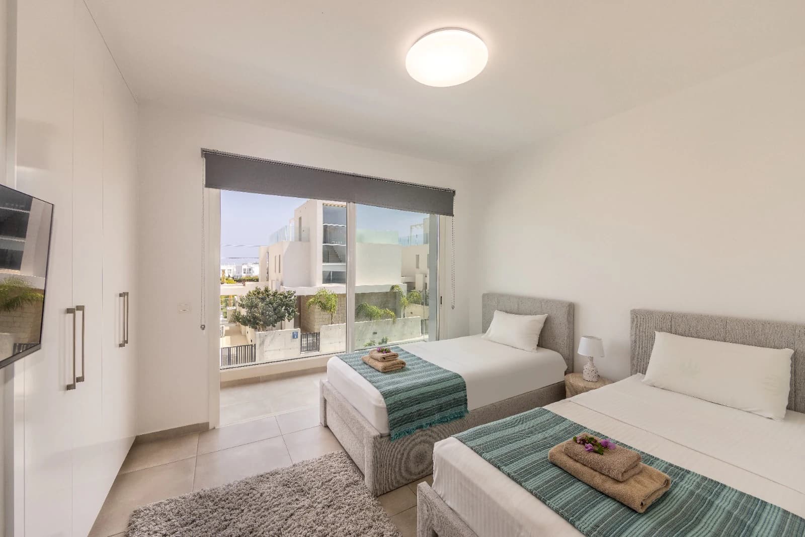 A twin bedroom opening onto its own balcony.