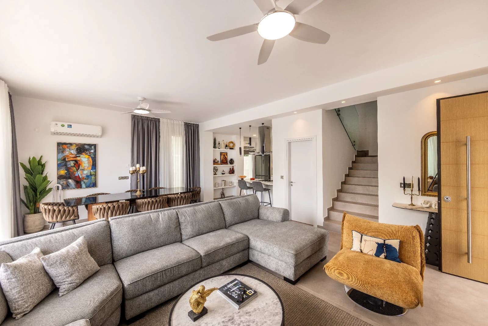 The living room with the staircase behind it.