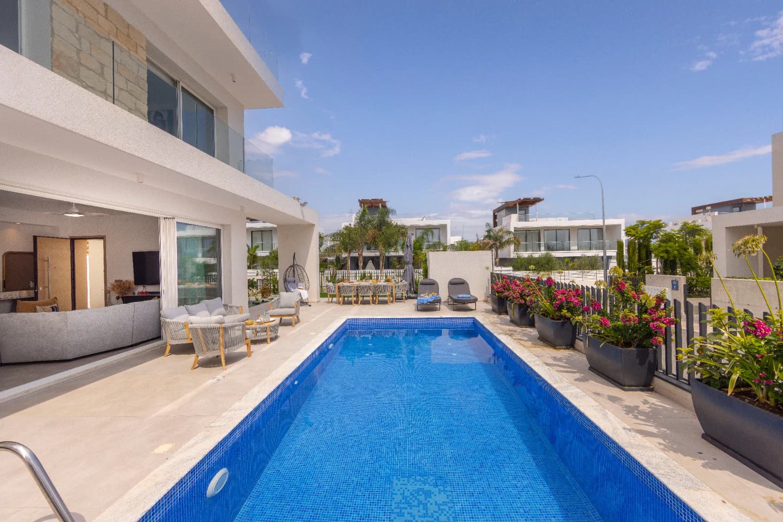 The pool running the length of the terrace toward the villa.