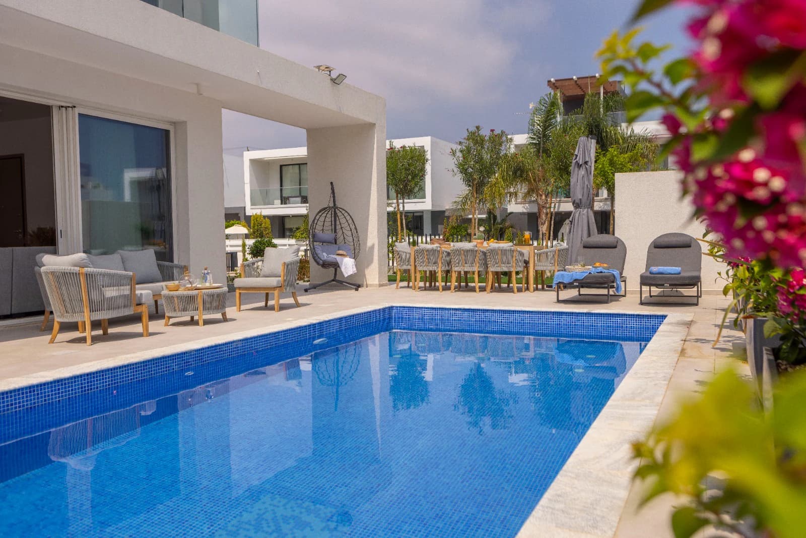 The pool framed by bougainvillea.